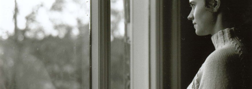 Student staring out the window at Utrecht University Library (photo by Andrea Hajek)
